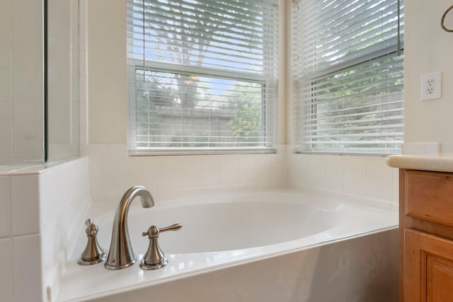 31 N Winterport Cir, The Woodlands, TX 77382 - full bath featuring healthy amount of natural light, a garden tub, and vanity