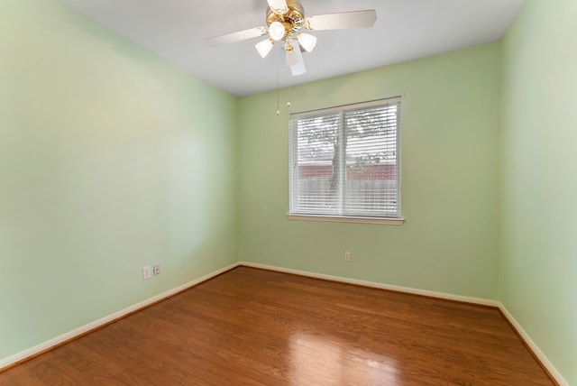 31 N Winterport Cir, The Woodlands, TX 77382 - empty room with wood finished floors and ceiling fan