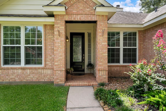 31 N Winterport Cir, The Woodlands, TX 77382 - doorway to property featuring brick siding and roof with shingles