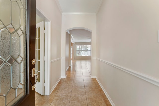 31 N Winterport Cir, The Woodlands, TX 77382 - hall featuring arched walkways, light tile patterned flooring, and ornamental molding