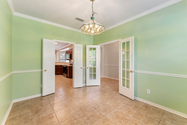 31 N Winterport Cir, The Woodlands, TX 77382 - empty room featuring french doors, a chandelier, ornamental molding, and light tile patterned flooring
