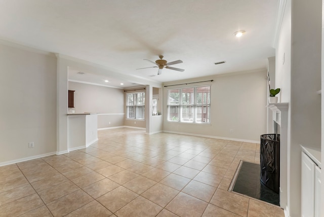31 N Winterport Cir, The Woodlands, TX 77382 - unfurnished living room featuring a ceiling fan, light tile patterned flooring, crown molding, a fireplace, and recessed lighting