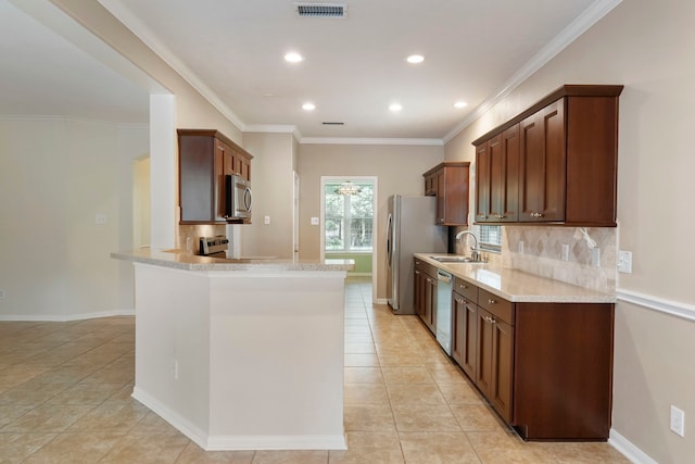 31 N Winterport Cir, The Woodlands, TX 77382 - kitchen with stainless steel appliances, light tile patterned floors, decorative backsplash, recessed lighting, and a peninsula