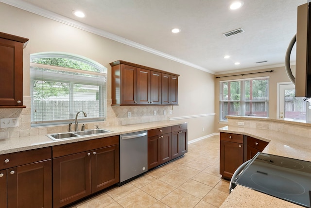 31 N Winterport Cir, The Woodlands, TX 77382 - kitchen with dishwasher, range with electric stovetop, light tile patterned flooring, recessed lighting, and backsplash