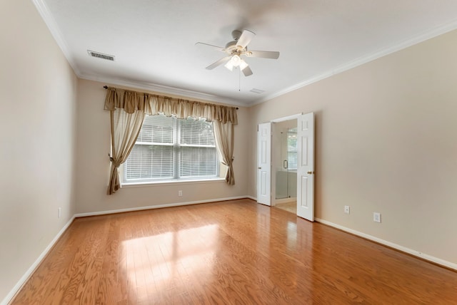 31 N Winterport Cir, The Woodlands, TX 77382 - unfurnished room featuring crown molding, ceiling fan, and wood finished floors