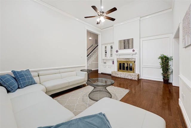 2814 Rustic Woods Dr, Houston, TX 77345 - living room with stairway, wood finished floors, a ceiling fan, ornamental molding, and a decorative wall