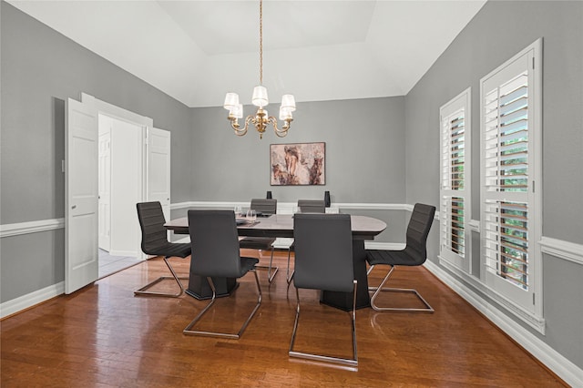 2814 Rustic Woods Dr, Houston, TX 77345 - dining area with wood finished floors, a chandelier, and vaulted ceiling