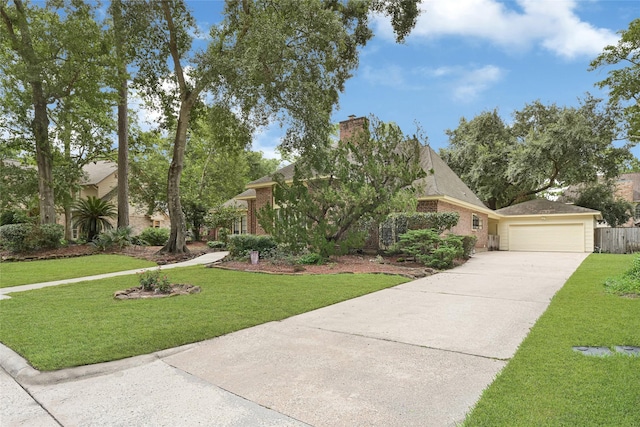 2814 Rustic Woods Dr, Houston, TX 77345 - view of property hidden behind natural elements featuring concrete driveway, an attached garage, brick siding, and a front lawn