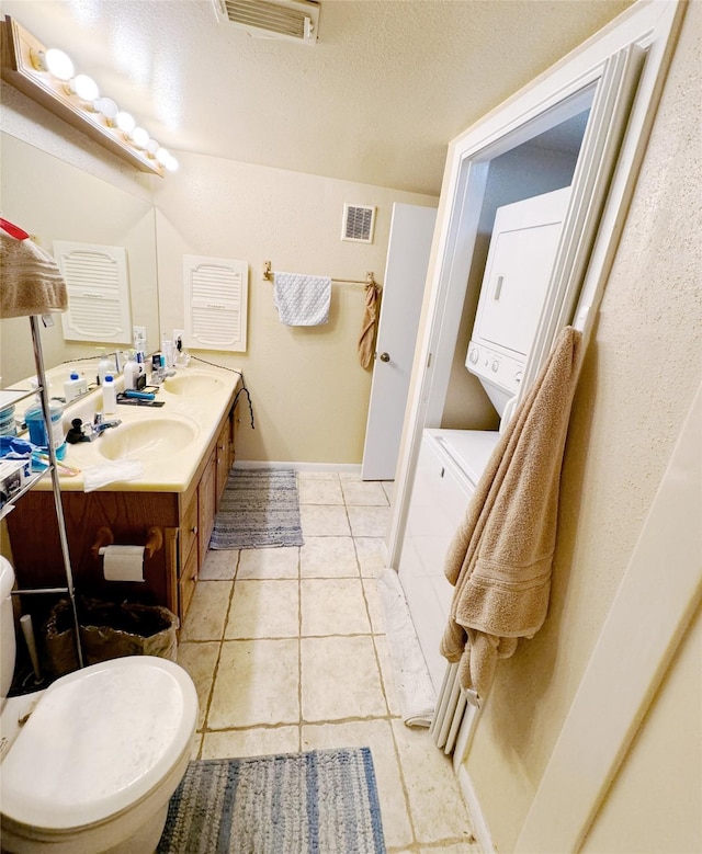 3075 Walnut Bend Ln Unit 36, Houston, TX 77042 - full bath featuring double vanity, tile patterned flooring, and a textured ceiling
