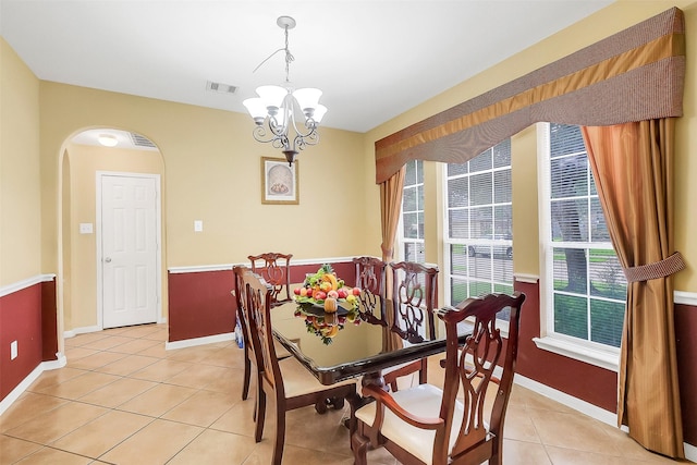3705 Canterbury Park Dr, Pearland, TX 77584 - dining room with a chandelier, light tile patterned floors, and arched walkways
