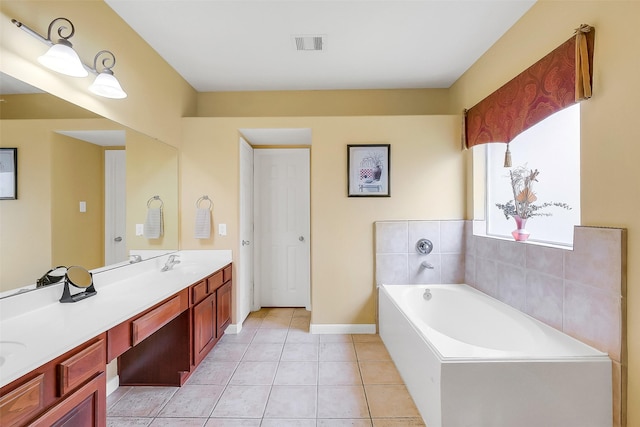3705 Canterbury Park Dr, Pearland, TX 77584 - bathroom featuring double vanity, a garden tub, and tile patterned flooring