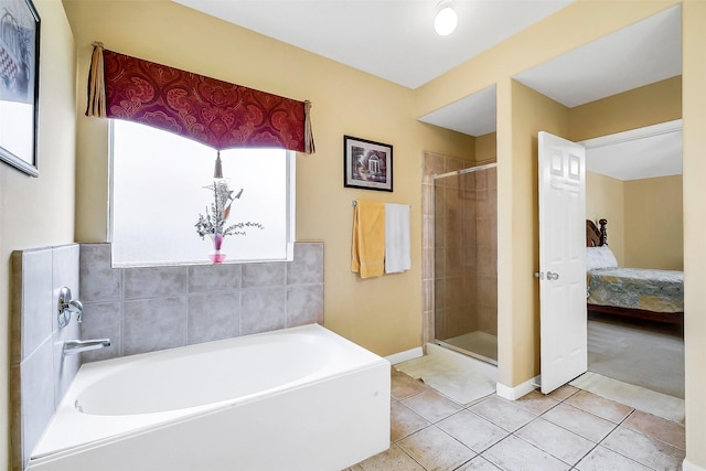3705 Canterbury Park Dr, Pearland, TX 77584 - bathroom with a garden tub, a shower stall, tile patterned flooring, and ensuite bath