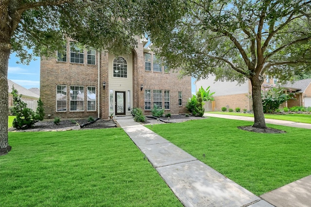 3705 Canterbury Park Dr, Pearland, TX 77584 - view of front of home with a front lawn and brick siding