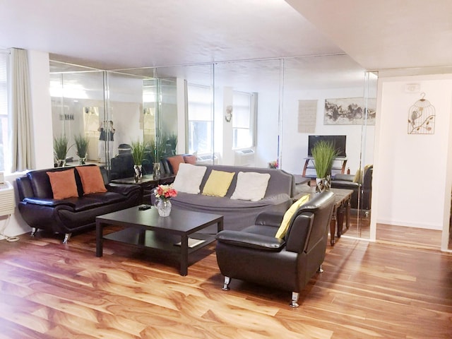 7520 Hornwood Dr Unit 303, Houston, TX 77036 - living area featuring healthy amount of natural light and wood finished floors