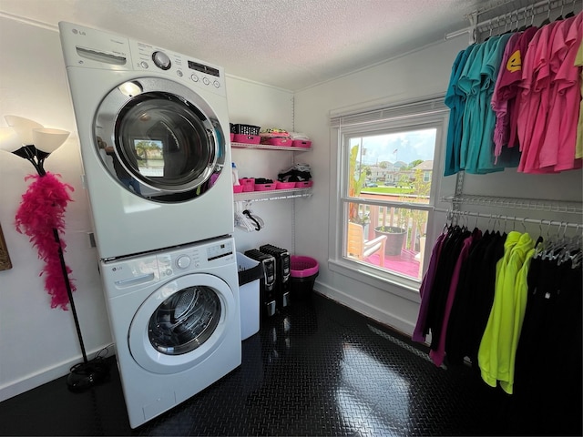 6625 Morris, Galveston, TX 77551 - laundry area with stacked washer / drying machine, a textured ceiling, and tile patterned flooring