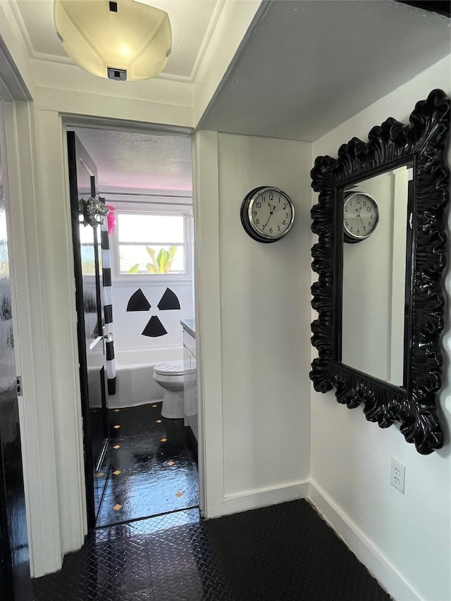 6625 Morris, Galveston, TX 77551 - hallway with dark tile patterned flooring and baseboards