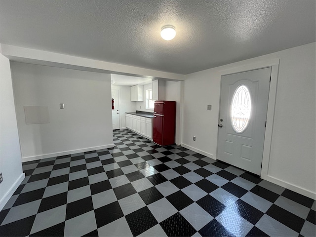 6625 Morris, Galveston, TX 77551 - foyer entrance with plenty of natural light, dark floors, and a textured ceiling
