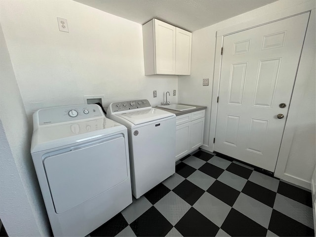 6625 Morris, Galveston, TX 77551 - washroom featuring dark floors, washing machine and clothes dryer, and cabinet space