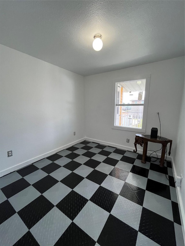 6625 Morris, Galveston, TX 77551 - unfurnished room featuring a textured ceiling and an office area