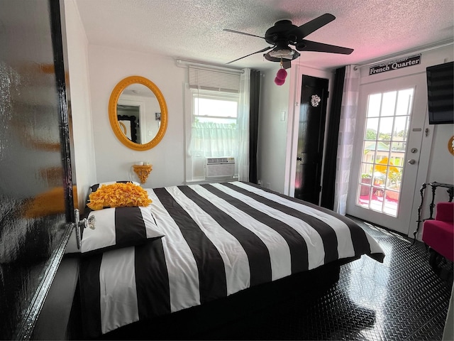 6625 Morris, Galveston, TX 77551 - bedroom featuring a textured ceiling, access to outside, multiple windows, a ceiling fan, and cooling unit