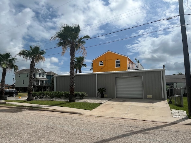 6625 Morris, Galveston, TX 77551 - view of front facade featuring driveway and a garage