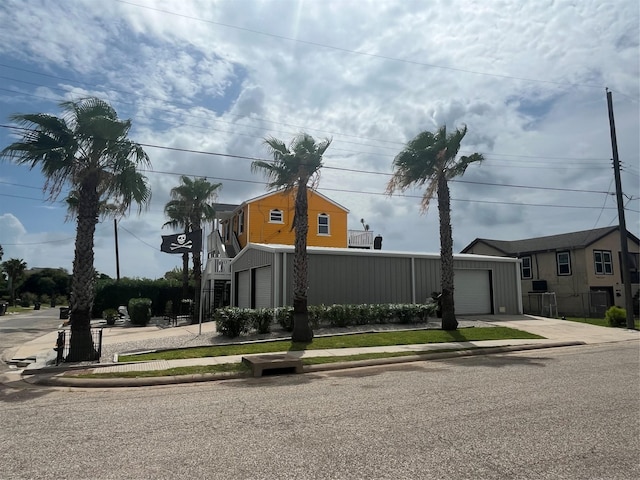 6625 Morris, Galveston, TX 77551 - view of front of home with a garage and concrete driveway