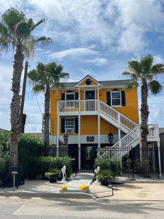 6625 Morris, Galveston, TX 77551 - raised beach house featuring a fenced front yard and stairway