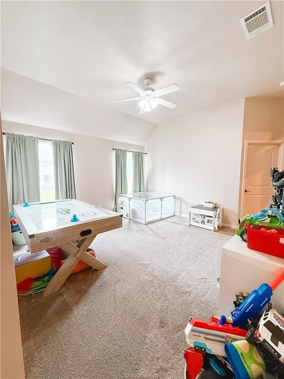 52 Fairway Dr, Normangee, TX 77871 - game room with healthy amount of natural light, carpet, ceiling fan, and lofted ceiling