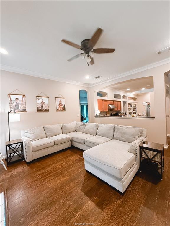 52 Fairway Dr, Normangee, TX 77871 - living room featuring a ceiling fan, ornamental molding, dark wood-style floors, and recessed lighting