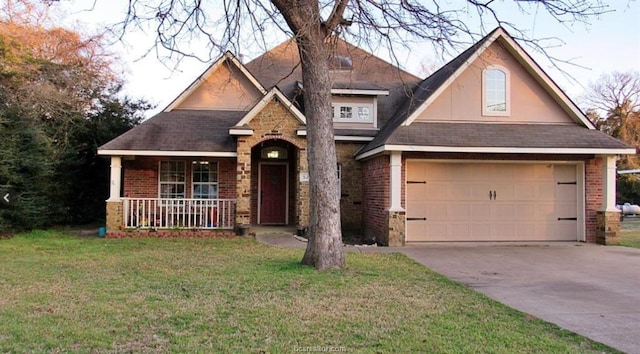 52 Fairway Dr, Normangee, TX 77871 - view of front facade featuring covered porch, brick siding, a front yard, and driveway