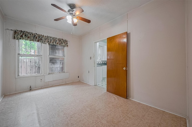 512 Threlkeld St, Houston, TX 77007 - spare room with ceiling fan, a textured ceiling, and light floors