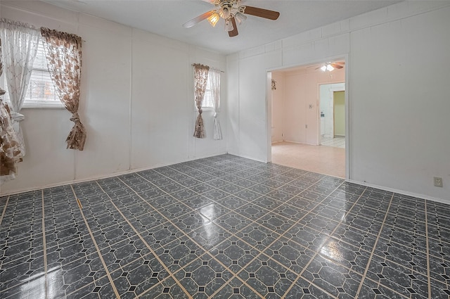 512 Threlkeld St, Houston, TX 77007 - spare room with a ceiling fan and tile patterned floors
