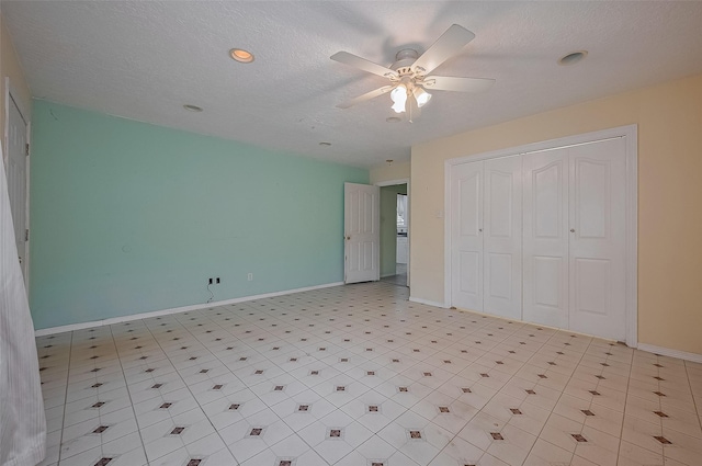 512 Threlkeld St, Houston, TX 77007 - unfurnished bedroom with a closet, ceiling fan, recessed lighting, and a textured ceiling