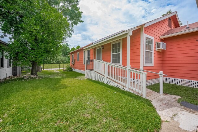 512 Threlkeld St, Houston, TX 77007 - view of yard featuring covered porch and a wall mounted AC