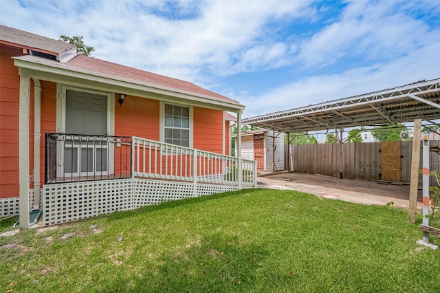 512 Threlkeld St, Houston, TX 77007 - view of yard with a storage unit and a carport