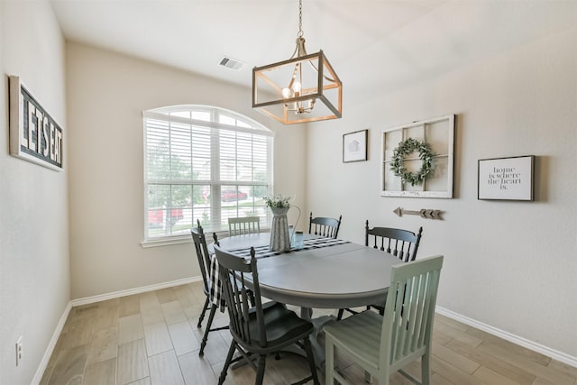24218 Birchwood Creek Ct, Spring, TX 77389 - dining area with a chandelier and light wood-type flooring