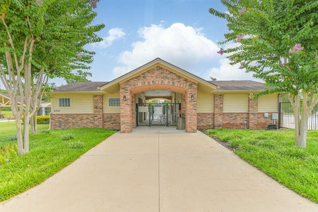 24218 Birchwood Creek Ct, Spring, TX 77389 - view of front of property featuring brick siding and a gate