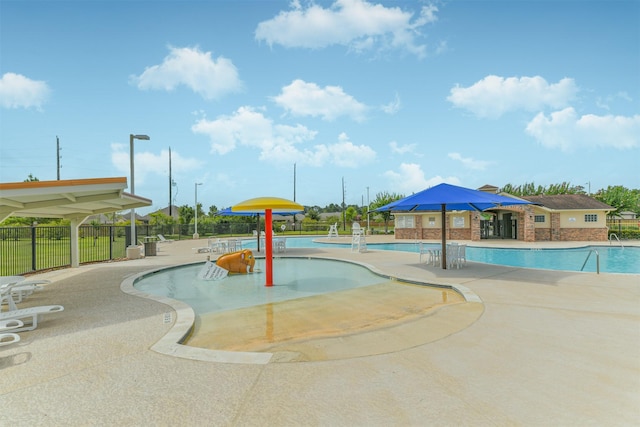 24218 Birchwood Creek Ct, Spring, TX 77389 - community pool featuring a water play area and a patio