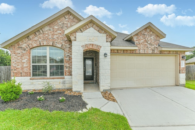 24218 Birchwood Creek Ct, Spring, TX 77389 - view of front of house with brick siding, concrete driveway, and a garage