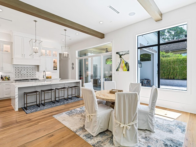 518 Hallie Dr, Houston, TX 77024 - dining room with beam ceiling, light wood finished floors, recessed lighting, and a chandelier