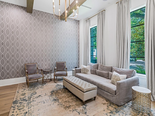 518 Hallie Dr, Houston, TX 77024 - living area featuring wood finished floors, wallpapered walls, and a chandelier