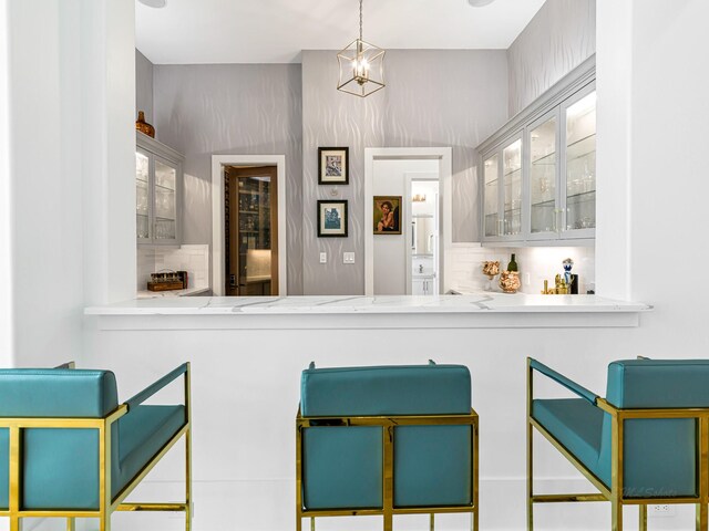 518 Hallie Dr, Houston, TX 77024 - bar featuring tasteful backsplash and pendant lighting