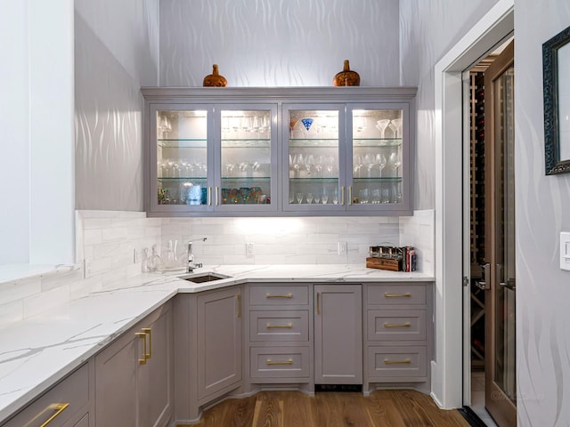 518 Hallie Dr, Houston, TX 77024 - bar featuring decorative backsplash and dark wood-type flooring