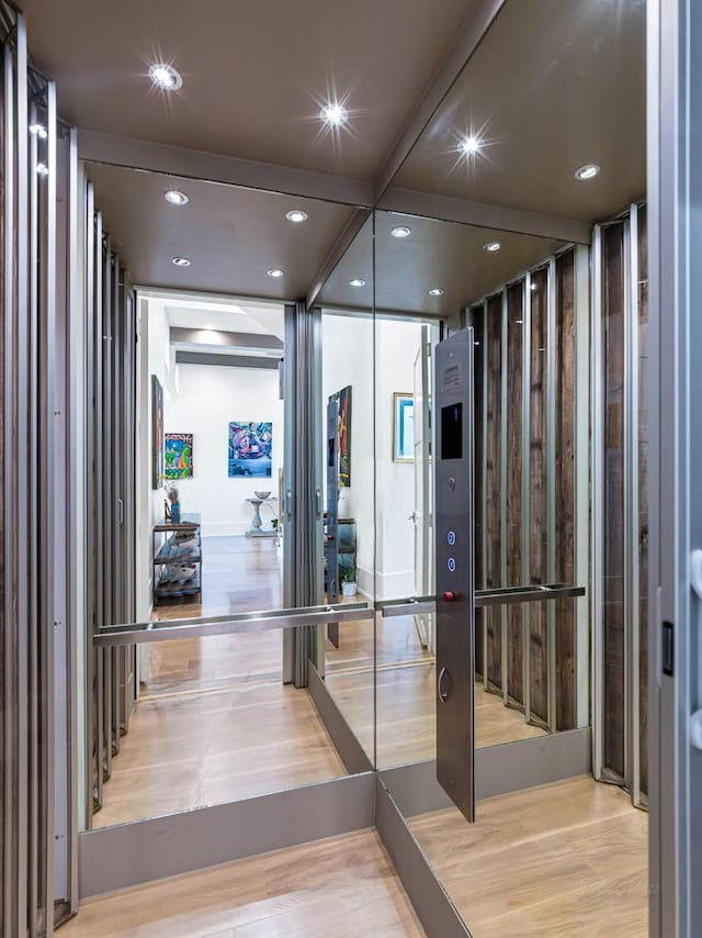518 Hallie Dr, Houston, TX 77024 - corridor featuring light wood finished floors and recessed lighting