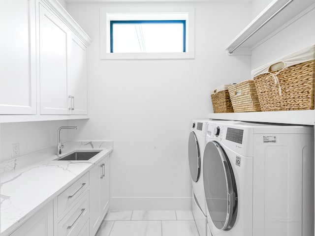 518 Hallie Dr, Houston, TX 77024 - laundry room featuring cabinet space and washer and dryer