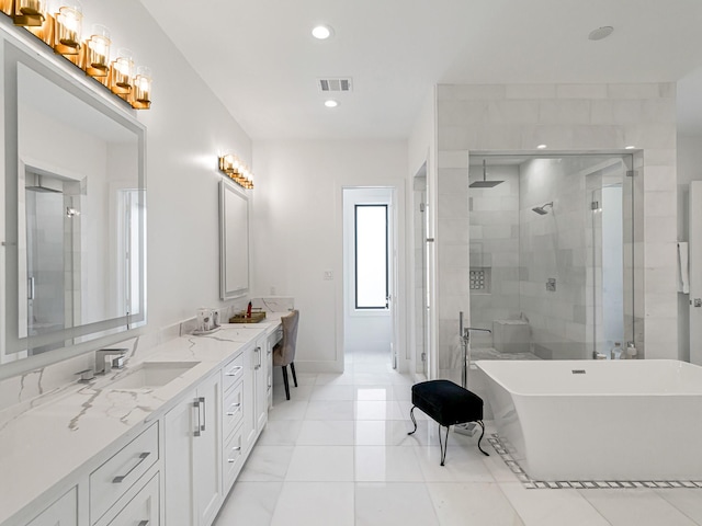 518 Hallie Dr, Houston, TX 77024 - full bathroom featuring a stall shower, a freestanding bath, double vanity, recessed lighting, and tile patterned floors
