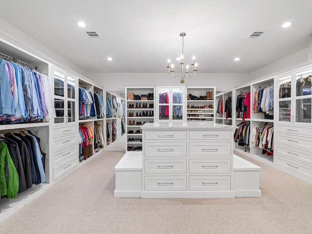 518 Hallie Dr, Houston, TX 77024 - walk in closet featuring light colored carpet and a chandelier