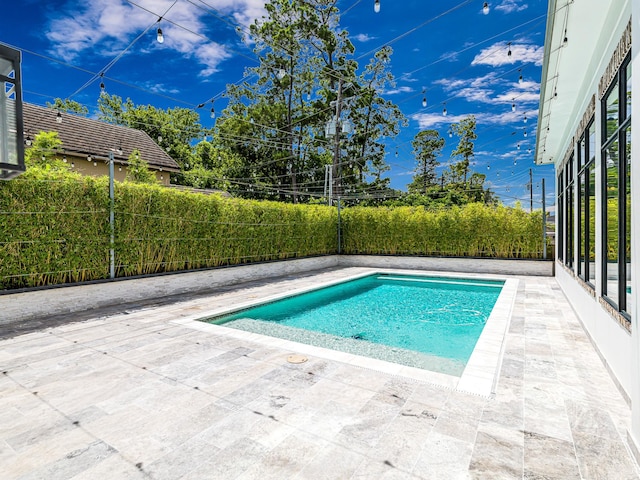 518 Hallie Dr, Houston, TX 77024 - view of swimming pool with a fenced backyard and a patio area