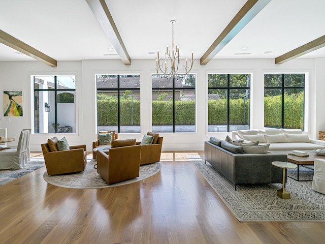 518 Hallie Dr, Houston, TX 77024 - living room featuring beam ceiling, a chandelier, and wood finished floors