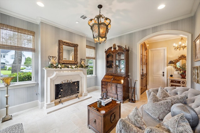 7614 Brykerwoods Dr, Houston, TX 77055 - living room with wallpapered walls, a chandelier, ornamental molding, arched walkways, and a fireplace with raised hearth